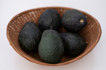 Avocados in a basket, healthy