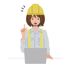 デスクで座ってPCを開いて何かひらめいた工事現場の女性