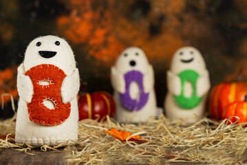 Halloween and boo dolls. Pumpkins, autumn and halloween. Harvest symbol and holiday tradition.