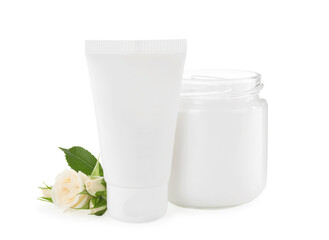 Different hand care cosmetic products and roses on white background