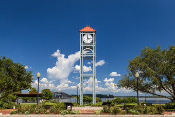 Photo of the clock tower at Riverfront Park in Palatka along the St John's River in Florida on a beautiful sunny day - Powered by Adobe