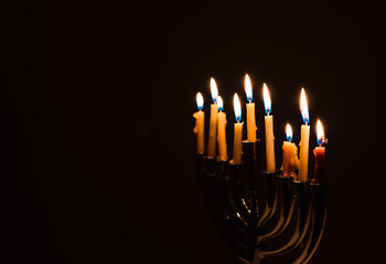 Minimal nine Chanukah candles in a dark with copy space
