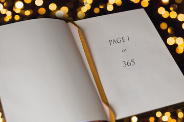 Open book with Page one of 365, new year concept