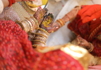Turmeric on hands of Indian bride in india 