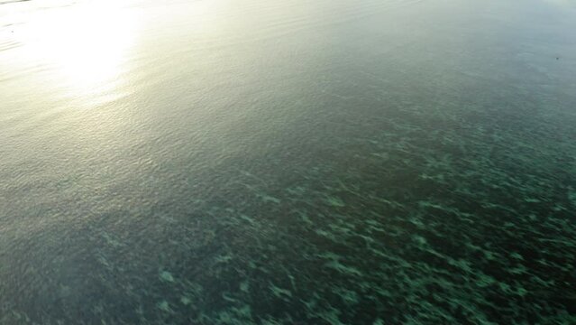 Aerial Forward Beautiful Shot Of Waves In Ocean During Sunset - Suva, Fiji