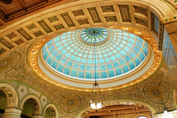 A large stained glass window, designed by Tiffany, hovers over the main atrium and lobby or the...