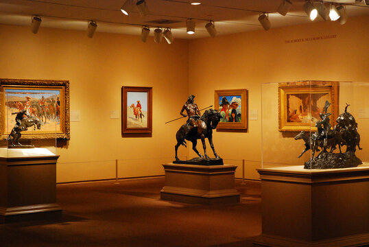 Western and native themed art fill up a museum gallery in the American Wing of the Art Institute of Chicago