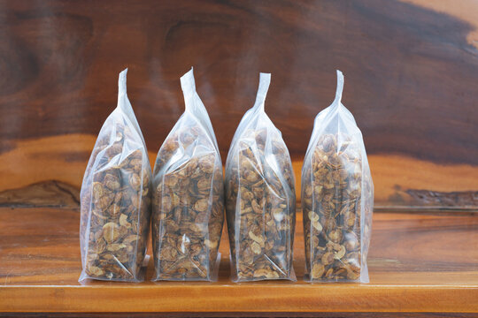 Caramel conflex in plastic bag package on wood table.plastic packaging concept.