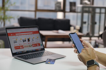 Man using smart phone and holding credit card with online shopping.Online payment concept. payment confirmation