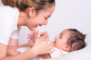 Portrait of happy mother and baby. Happy mom smile with family and love newborn.