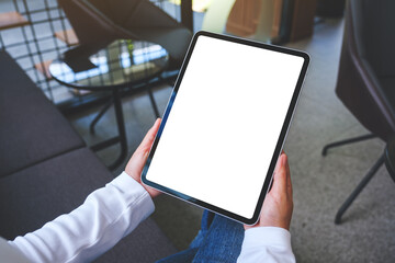 Mockup image of a woman holding digital tablet with blank white desktop screen