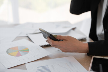 Close up business woman using calculator for math finance in office and business, taxes, accounting, statistics and research analytics