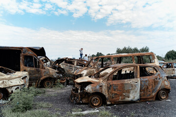 Obraz premium 15.07.2022,Bucha Car graveyard. Shot cars of civilians. russia's war against Ukraine