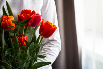 A bright bouquet of tulips in your hand