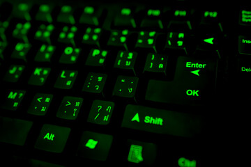 black keyboard reflective green letters