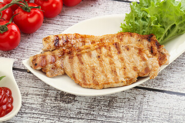 Grilled pork steak with ketchup