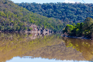 Photograph of reflections of trees in the Hawkesbury River in Australia