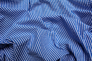 blue and white stripes fabric closeup , tablecloth texture