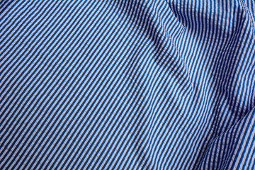 blue and white stripes fabric closeup , tablecloth texture