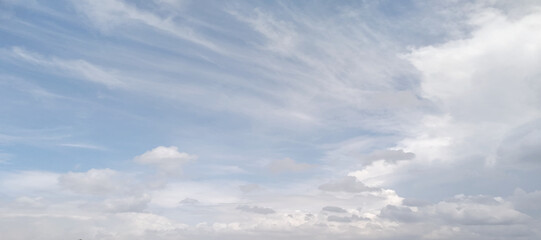 Bright blue sky with white clouds for background or wallpapers. The beauty of tropical nature for graphic design. blue sky background with white clouds. 