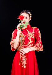 A woman in a red Traditional Chinese wedding dress