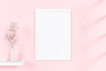 Fototapeta na wymiar A mockup picture frame with flower vase on pink wall background. 3d rendered illustration.