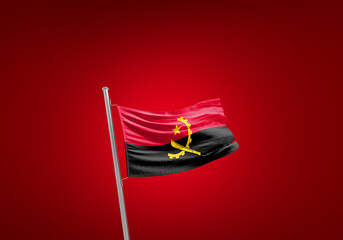 Angola flag waving in the wind on flagpole. - obrazy, fototapety, plakaty