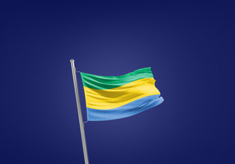 Gabon flag waving in the wind on flagpole.