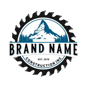 Mountain Logo Vintage Design In Chainsaw. For Home Improvement Construction And Carpentry