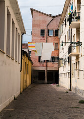 Fototapeta na wymiar Charming narrow street and laundry hung to dry in Venice, Italy