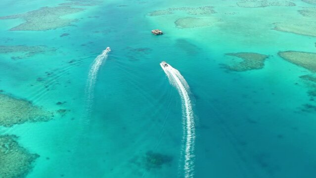 Aerial Forward Beautiful Shot Of Speedboats Moving On Sea During Sunny Day - Suva, Fiji