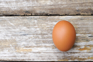 Farm fresh eggs isolated on wooden table.