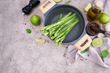 Green organic natural boiled Asparagus in a pot on kitchen table