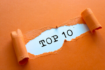 Torn brown paper revealing the words Top 10