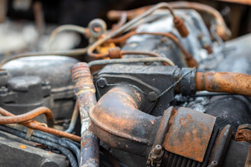 Burnt rusty car. A civilian car with people in Ukraine was shot and burned by the Russian military.