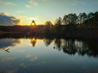 Fototapeta na wymiar Dawn of the sun on a blue lake in Kazan.