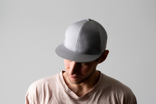 A Male Person Wearing Blank Simple Baseball Snapback Hat Mockup Copy Space Template