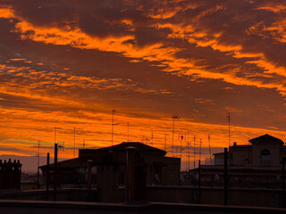 Fototapeta na wymiar Sunrise over Rome, Italy from the roof of a residential apartment building