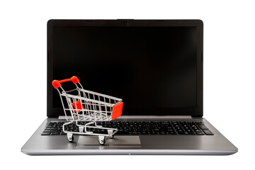 Shopping Online Concept : mini shopping cart on laptop