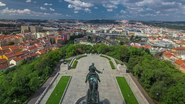 Panoramic view of Prague timelapse from the top of the Vitkov Memorial, Czech Republic. Old Town with red roofs. Cloudy sky at summer day