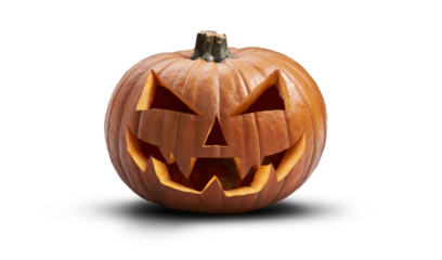 A carved halloween pumpkin with evil eyes and face isolated on white.
