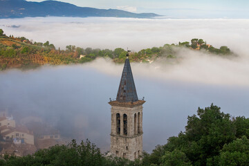 Spoleto, Perugia. Veduta del Campanile del Duomo con nebbia dalla Rocca di Albornoz.