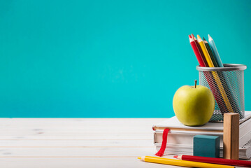 Back to school abstract background. School equipment on blue background with copy-space