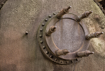 Background heavy industry large pressure relief valve with steel springs on a rusty boiler