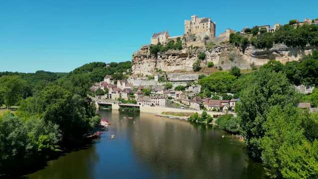 Aerial view Beynac castle and canoes on the river dordogne perigord France, High quality video
