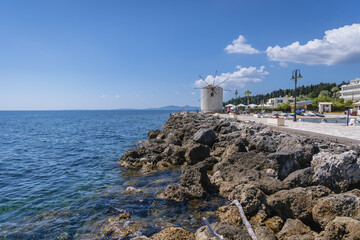 Fototapeta na wymiar Windmill over Ionian Sea in Corfu town on Corfu Island in Greece