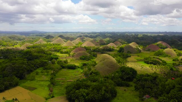 Aerial view of Chocolate hills in Bohol island,Philippines. Hills covered with grass and vegetation.