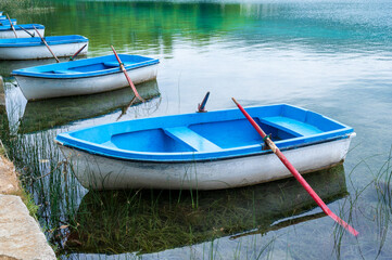 Fototapeta na wymiar Boats in the lake of Bañolas, Catalonia, Spain