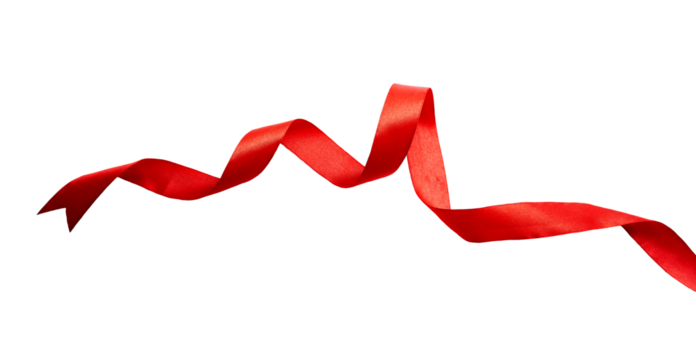 A curly red ribbon for Christmas and birthday present isolated against a transparent background.