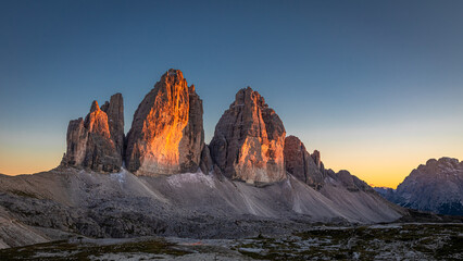 Tre Cime peaks at sunset in Dolomites in Italy